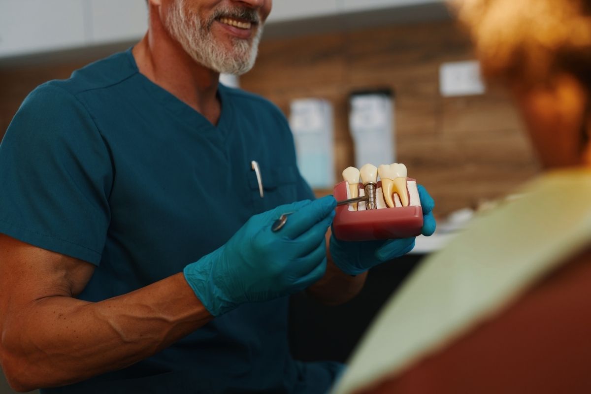 dentist holding dental implant module